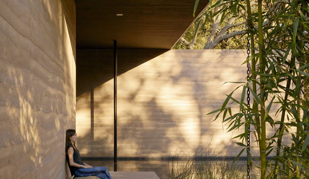 A stone bench salvaged from Stanford’s “bone yard” provides a private spot for reflection : Photo credit © Matthew Millman