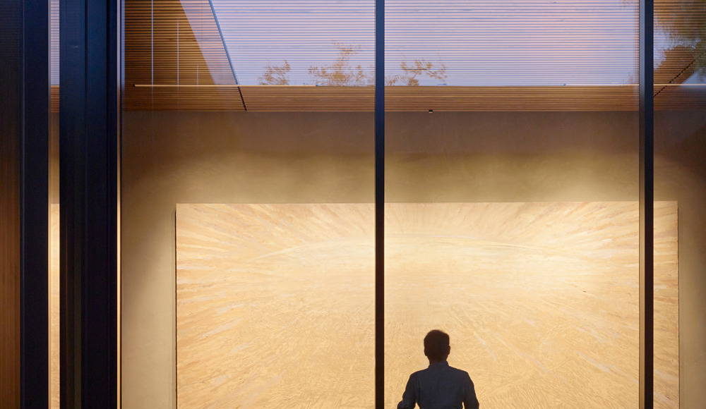 A fountain provides ambient sound to support contemplation while the fully glazed wall beyond allows views in the North Gallery : Photo credit © Matthew Millman