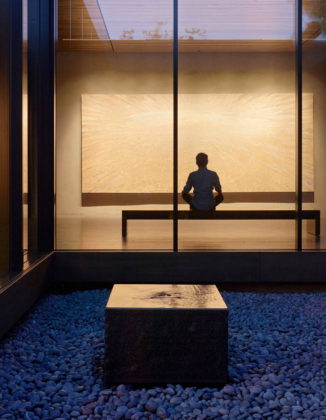 A fountain provides ambient sound to support contemplation while the fully glazed wall beyond allows views in the North Gallery : Photo credit © Matthew Millman