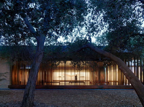 View from the Oak Grove at dusk. The paintings are lit through the evening hours allowing visitors to access them visually at any time : Photo credit © Matthew Millman