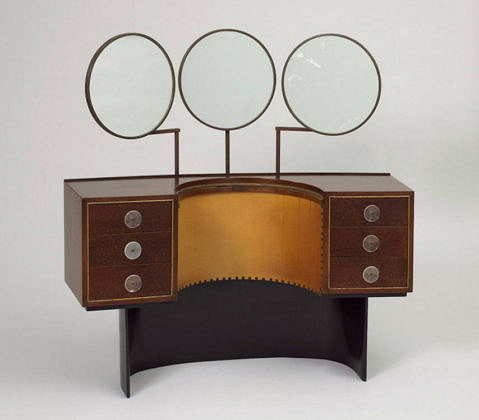 Designed by Gilbert Rohde (American, 1894 – 1944) Vanity Model 3920 Designed 1939 East Indian laurel, Sequoia burl, oak, acrylic, brass, patinated steel, leather, mirrored glass H x W x D: 127 × 127 × 43.2 cm (50 × 50 × 17 in.) Manufactured by Herman Miller Furniture Company (Zeeland, Michigan, USA) : Photo Matt Flynn © Smithsonian Institution