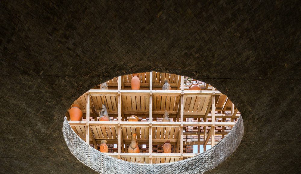 The artist's turntable is located at the centre of the ground level, directly beneath the round void allows visitors to observe the artist at work from the floors above : Photo credit © Hiroyuki Oki