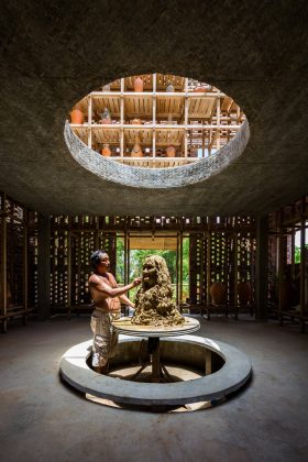 The artist's turntable is located at the centre of the ground level, directly beneath the round void allows visitors to observe the artist at work from the floors above : Photo credit © Hiroyuki Oki