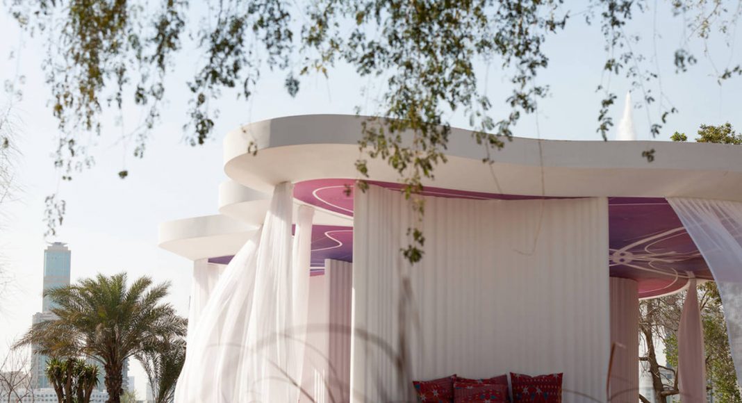 The Literature Pavilion, an open structure or about 40 visitors with no climatic sheath, is reminiscent of stylised Bedouin tent where people sit on the floor – cushions and blankets are covered in a fabric specially woven in Germany : Photo credit © Sascha Jahnke