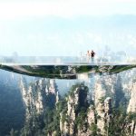 Mirroring the environment, the bridge is an elliptical disk. An off-centered hole leaves open views into the gap between the two rock faces. A strong net allows courageous visitors to lay down in the void : Photo credit © Martin Duplantier Architectes