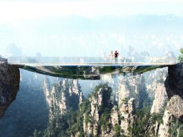 Mirroring the environment, the bridge is an elliptical disk. An off-centered hole leaves open views into the gap between the two rock faces. A strong net allows courageous visitors to lay down in the void : Photo credit © Martin Duplantier Architectes