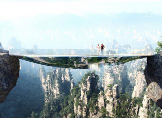 Mirroring the environment, the bridge is an elliptical disk. An off-centered hole leaves open views into the gap between the two rock faces. A strong net allows courageous visitors to lay down in the void : Photo credit © Martin Duplantier Architectes