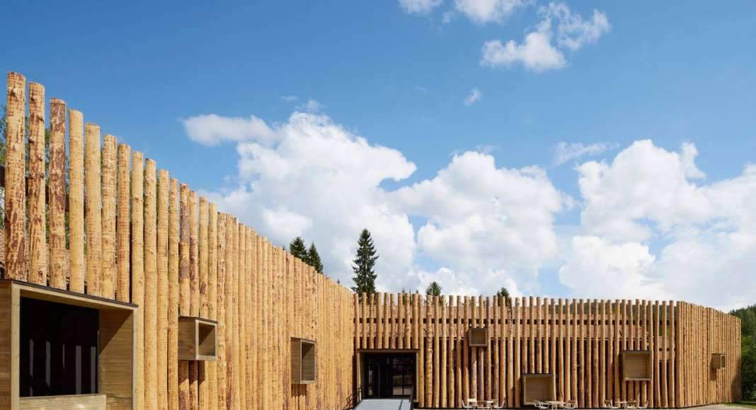 The protruding wooden boxes transform the building to an urban furniture : Photo credit © Åke E:son Lindman