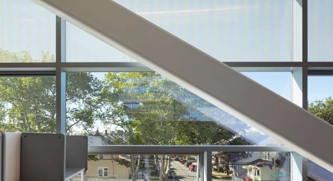 Second story offices look out upon the nearby community of small scale residential buildings : Photo credit © Paul Warchol