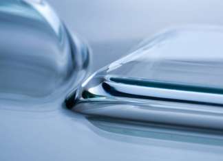 Prototype sheet glass with very small radii, produced using the new laser-based glass forming technology : Photo © Felizitas Gemetz/Fraunhofer IWM