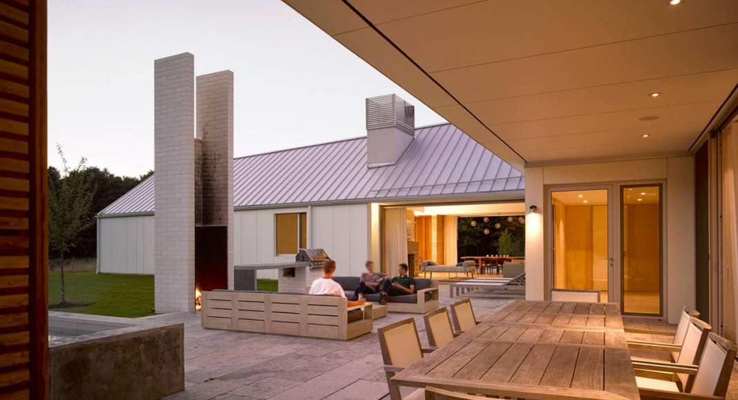 A view of the courtyard and covered dining space from Phase Two : Photo credit © Ben Rahn / A-Frame Studio