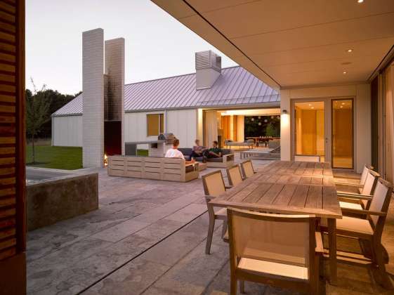 A view of the courtyard and covered dining space from Phase Two : Photo credit © Ben Rahn / A-Frame Studio