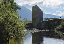 The building is expressed as taking a piece out of the rock and moving it to the opposite side of the river : Photo credit © Steinar Skaar