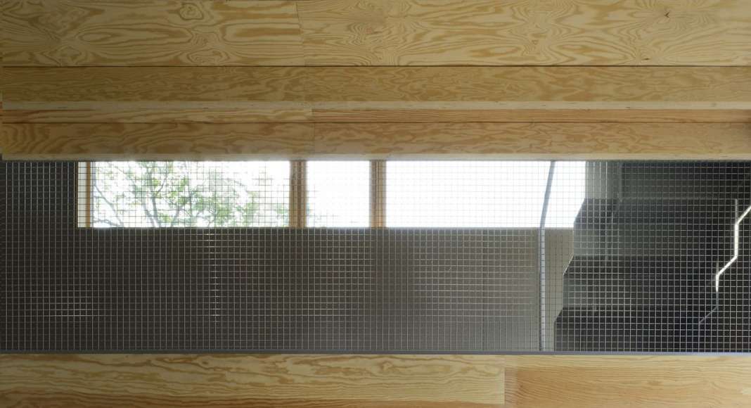 Kitchens and upper living room with slab ceilings. Light slides diagonally throughout the entire building. : Photo © Bornstein Lyckefors Arkitekter